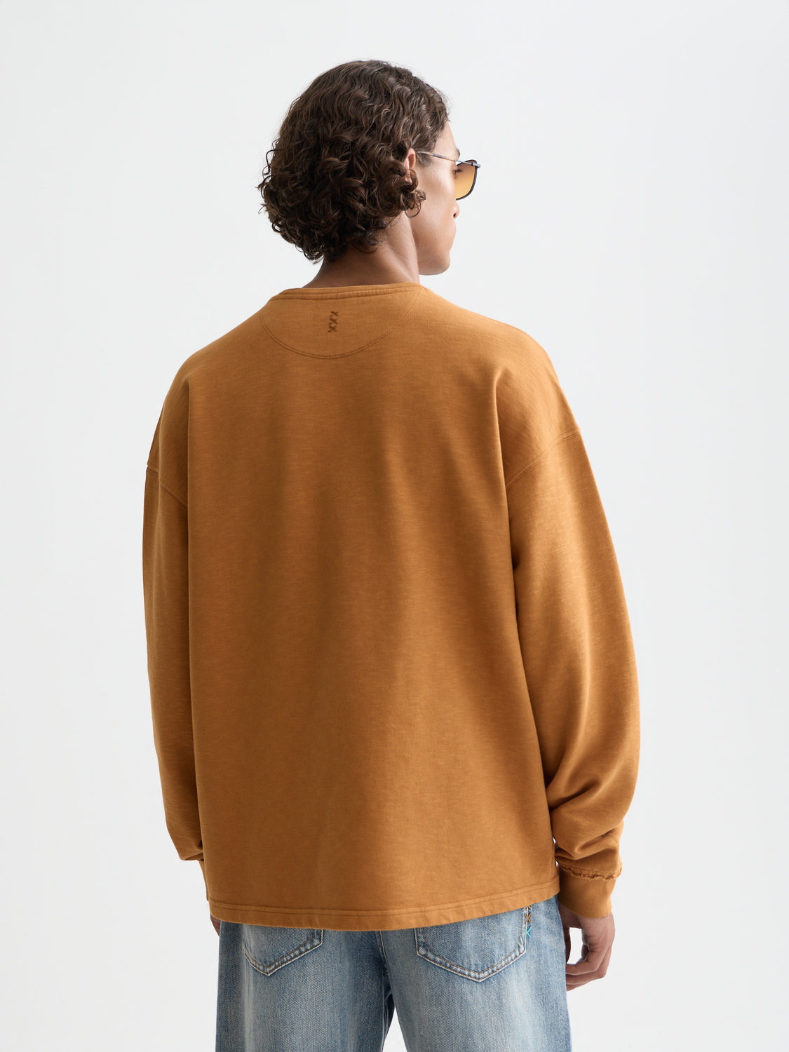 Blue sweatshirt by Scotch & Soda featuring three cross designs on the front, casual fit, and ribbed cuffs and hem.