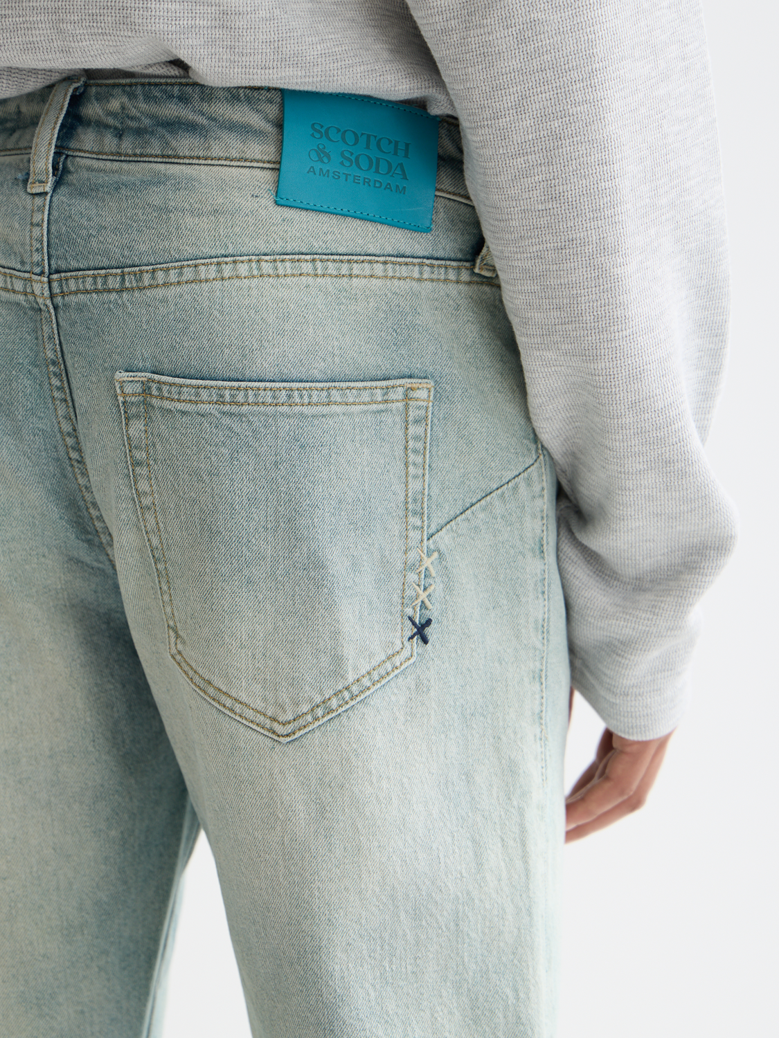 Scotch & Soda Zee straight-fit denim jeans showing classic five-pocket style and dark blue wash.