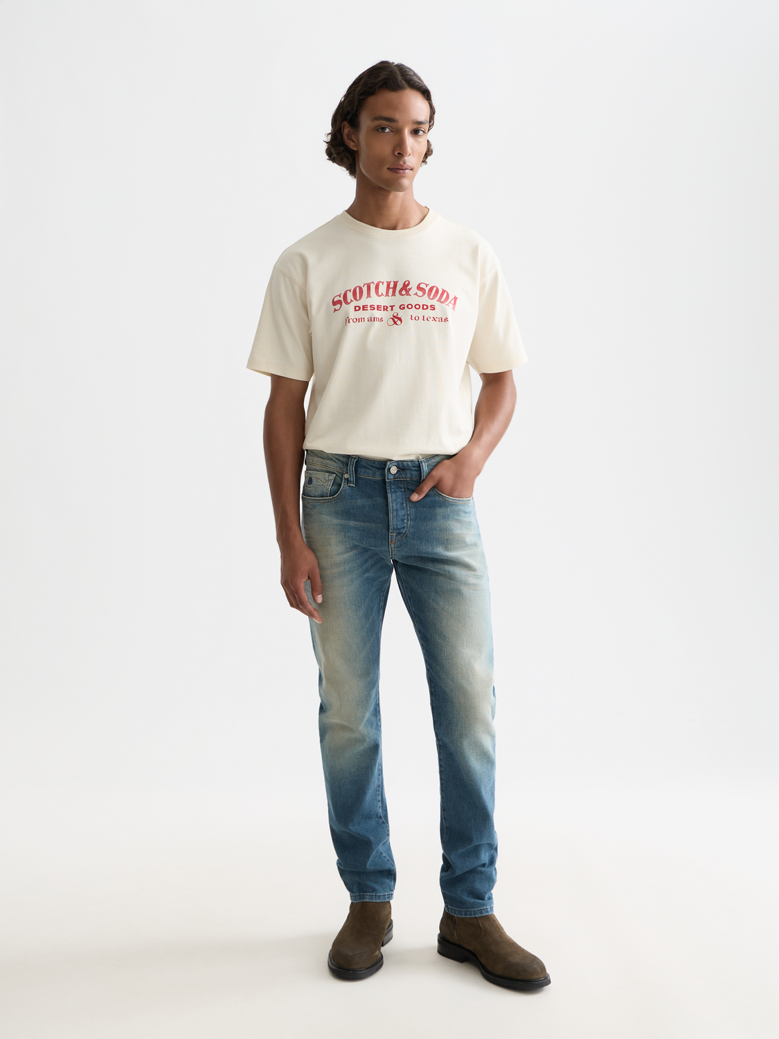 Scotch & Soda Ralston slim-fit denim jeans displayed on a model, showcasing their modern fit and dark wash finish.