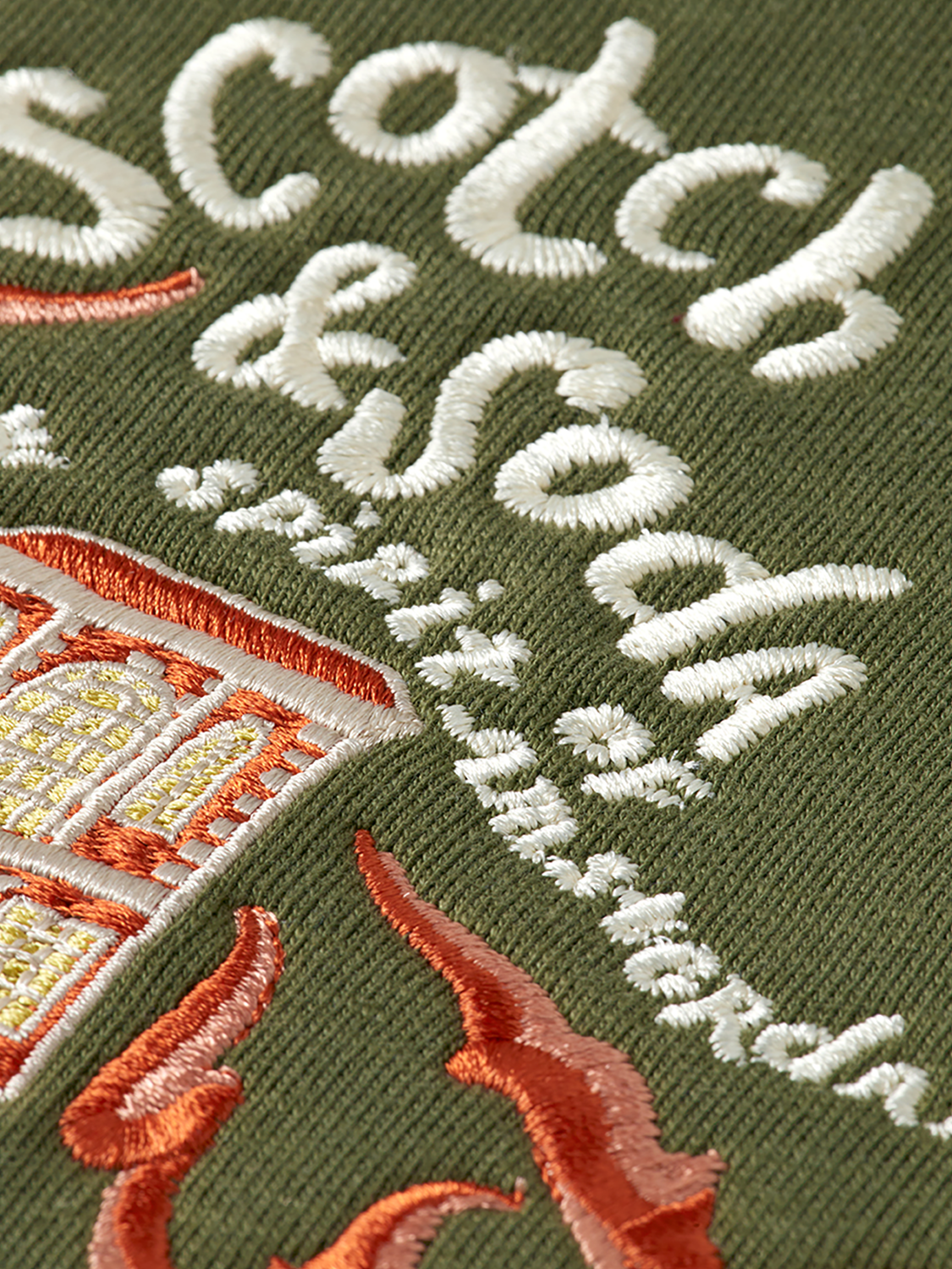 Embroidered hoodie from Scotch & Soda featuring detailed stitching, casual fit, and soft fabric for comfortable wear.