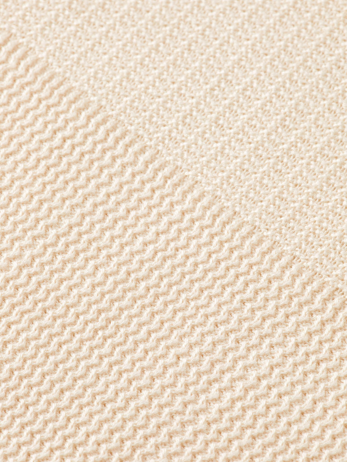 Knitted tonal polo shirt by SCOTCH & SODA with a classic collar and short sleeves, displayed flat on a neutral background.