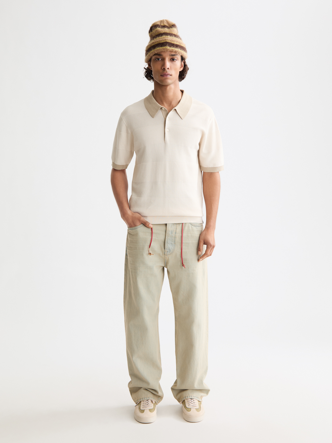 Knitted tonal polo shirt by Scotch & Soda, featuring a classic collar and textured fabric in neutral tones.