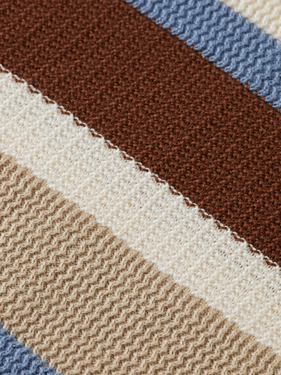 Striped knitted polo shirt by Scotch & Soda, featuring a classic collar and vibrant stripe pattern.