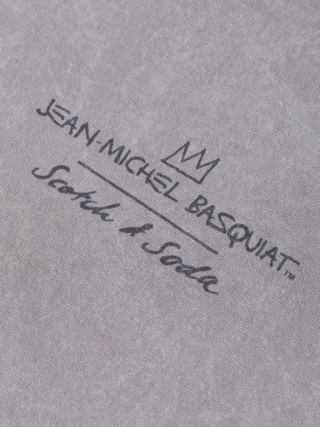 Short sleeve Scotch & SODA t-shirt featuring a vibrant Basquiat artwork print on the front.