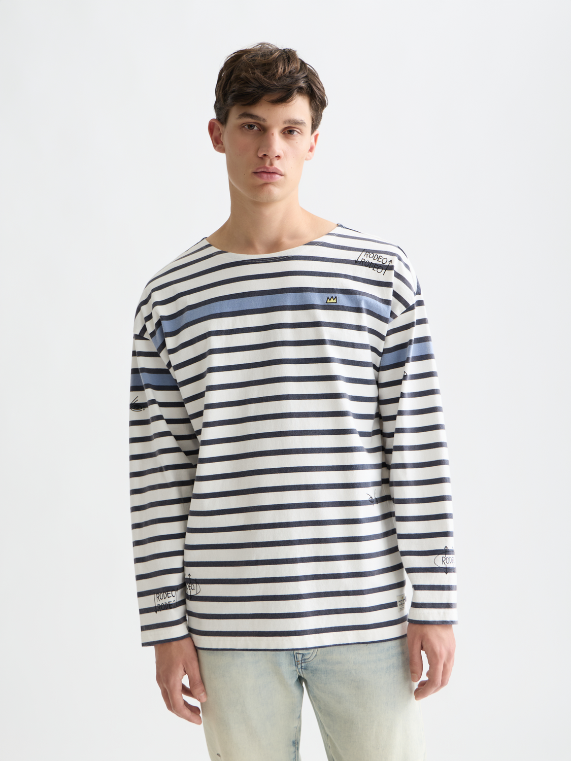 Long sleeve Breton striped t-shirt by Scotch & Soda featuring S&S x Basquiat artwork and classic blue and white stripes.