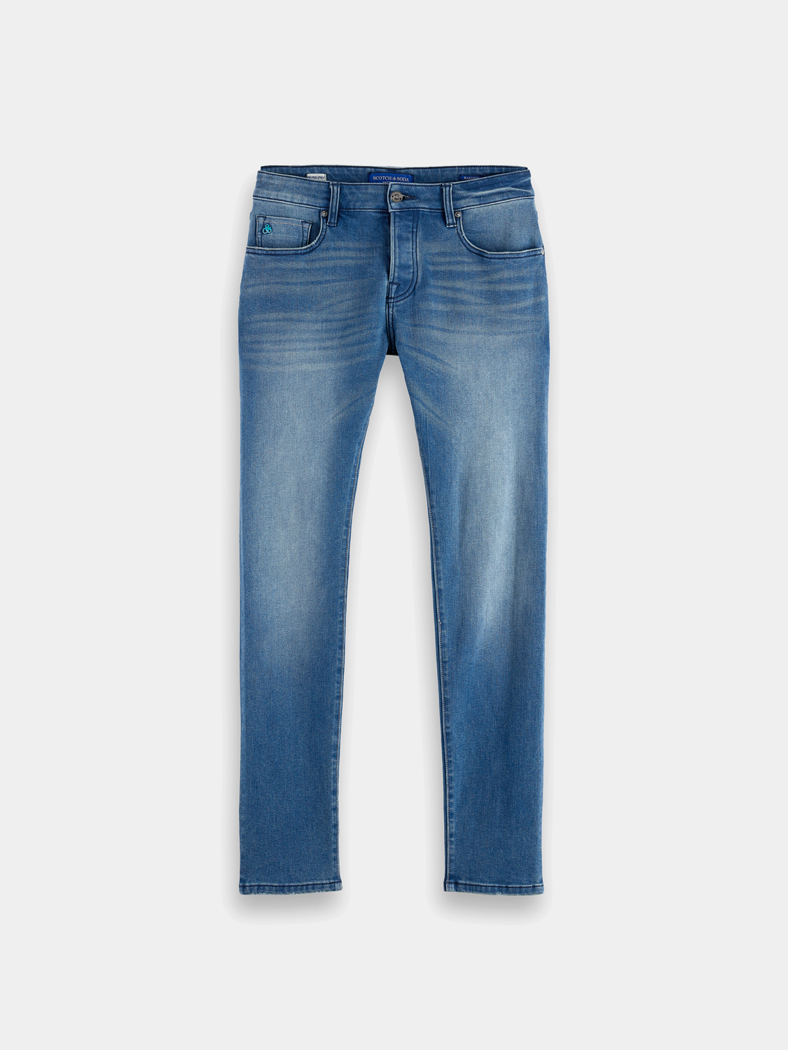 SCOTCH & SODA Ralston slim-fit denim jeans displayed on a hanger, showcasing classic blue denim with subtle stitching details.