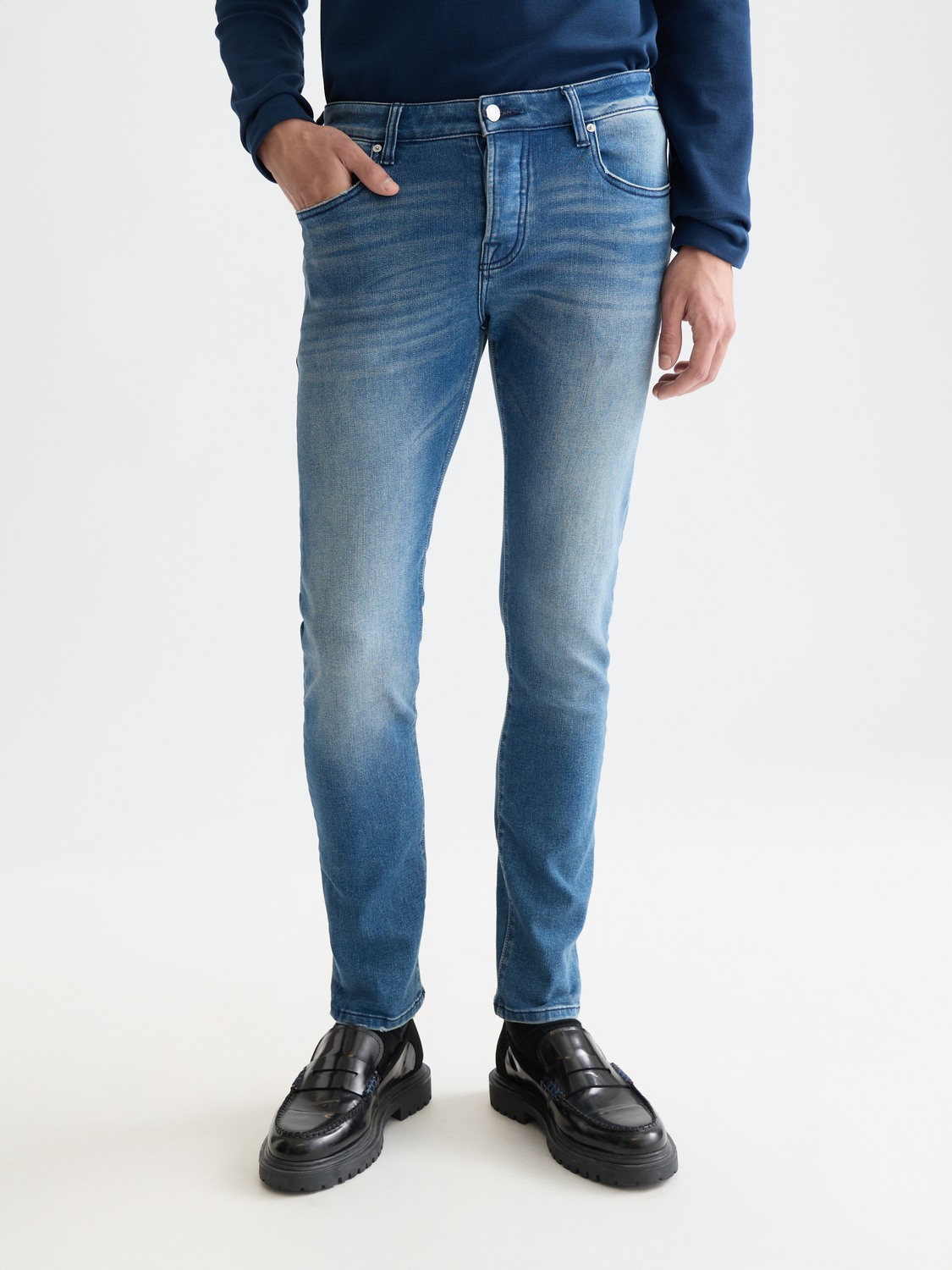Scotch & Soda Ralston slim-fit denim jeans showing front view with classic five-pocket design and dark wash fabric.