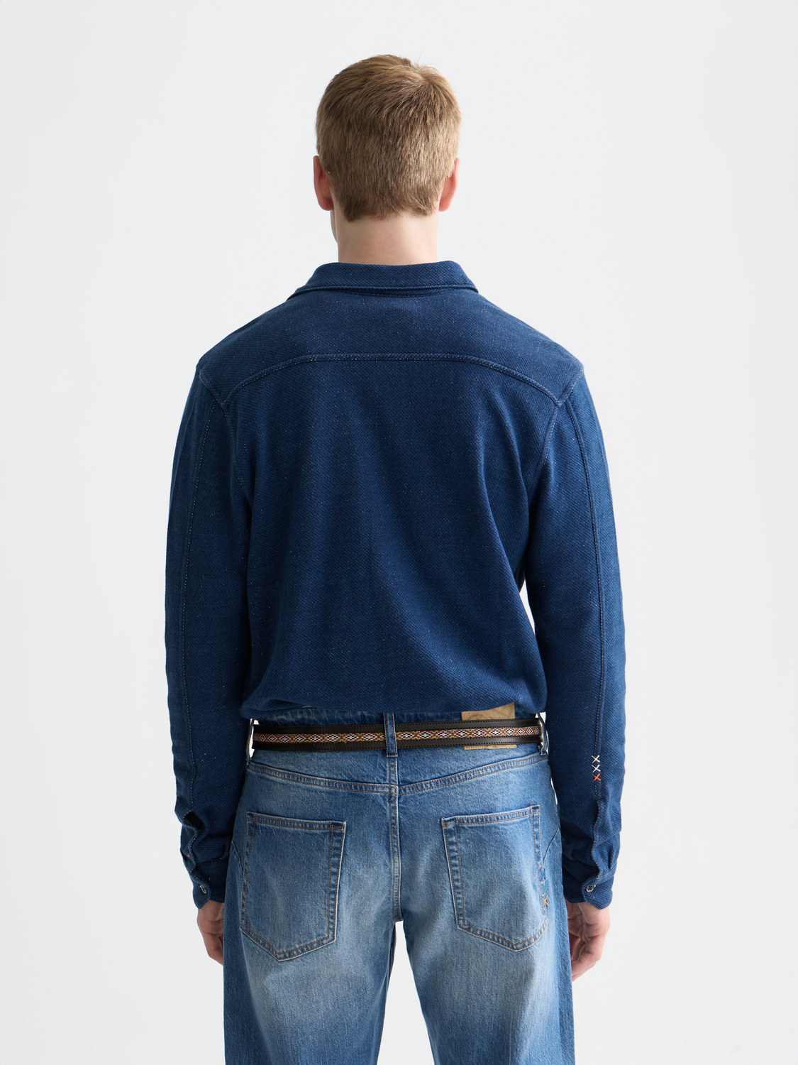 Washed indigo Scotch & Soda long-sleeve shirt with button-up front and casual fit, shown on a hanger.