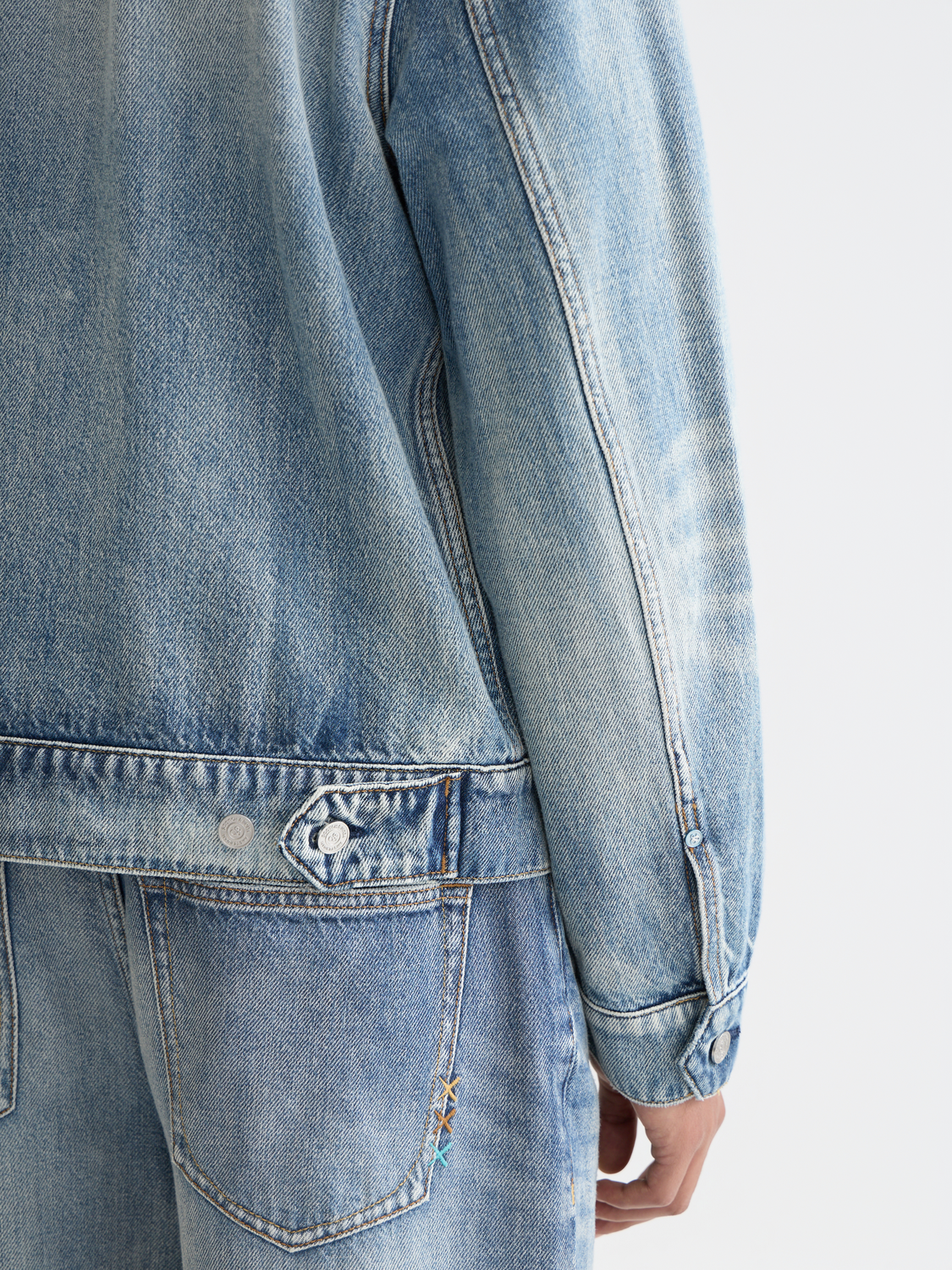 Washed ranch jacket by Scotch & Soda, casual denim jacket with distressed details and button closure, worn by male model.