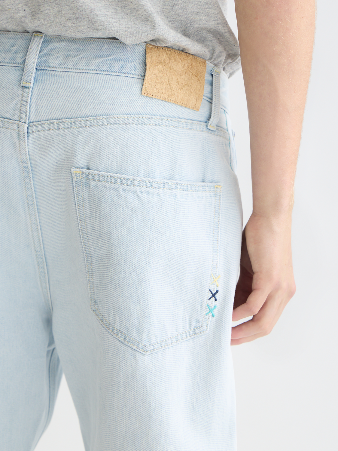 SCOTCH & SODA Dean tapered denim jeans showing slim fit design and classic five-pocket style.