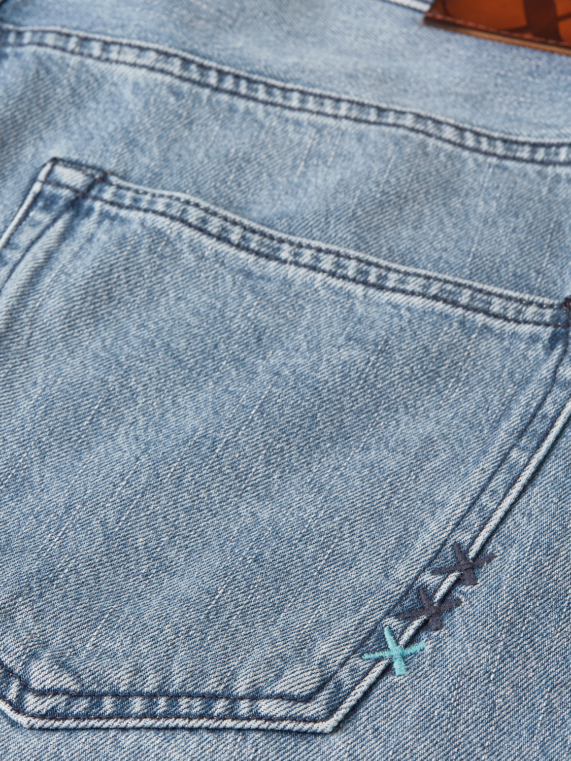 Scotch & Soda denim shorts with a loose-fit design, casual style, and classic blue denim fabric, front view image.