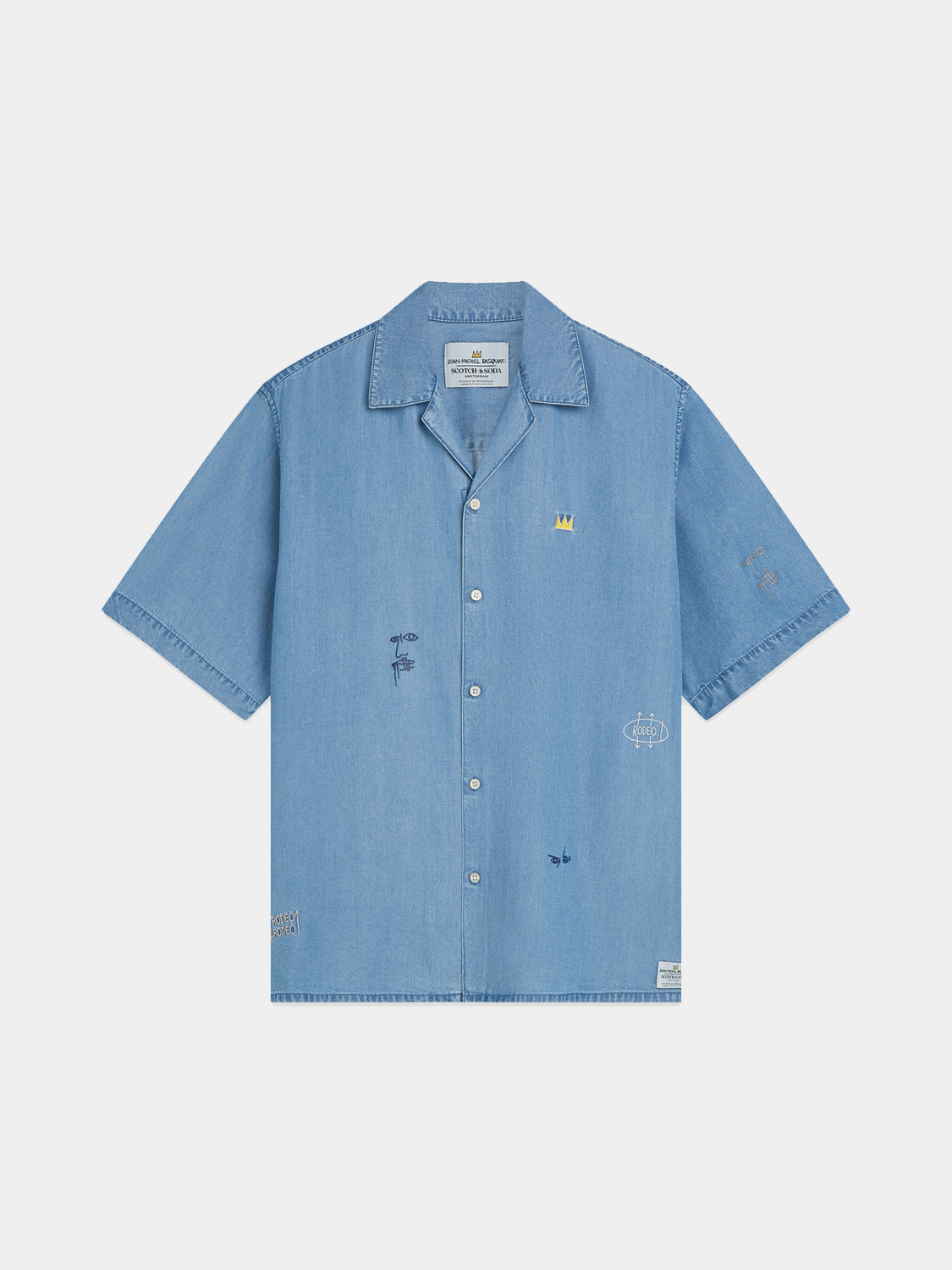 Short-sleeved indigo shirt by SCOTCH & SODA featuring Basquiat artwork, with a relaxed fit and button-front design.