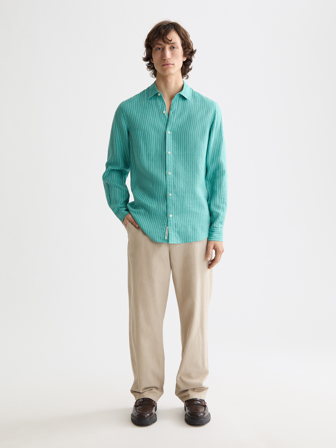 Long-sleeve striped linen shirt by Scotch & Soda, displayed flat showing navy and white vertical stripe pattern.