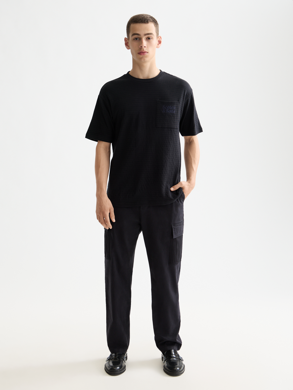 Front view of Scotch & Soda double face pocket short-sleeve t-shirt with contrasting fabric details.