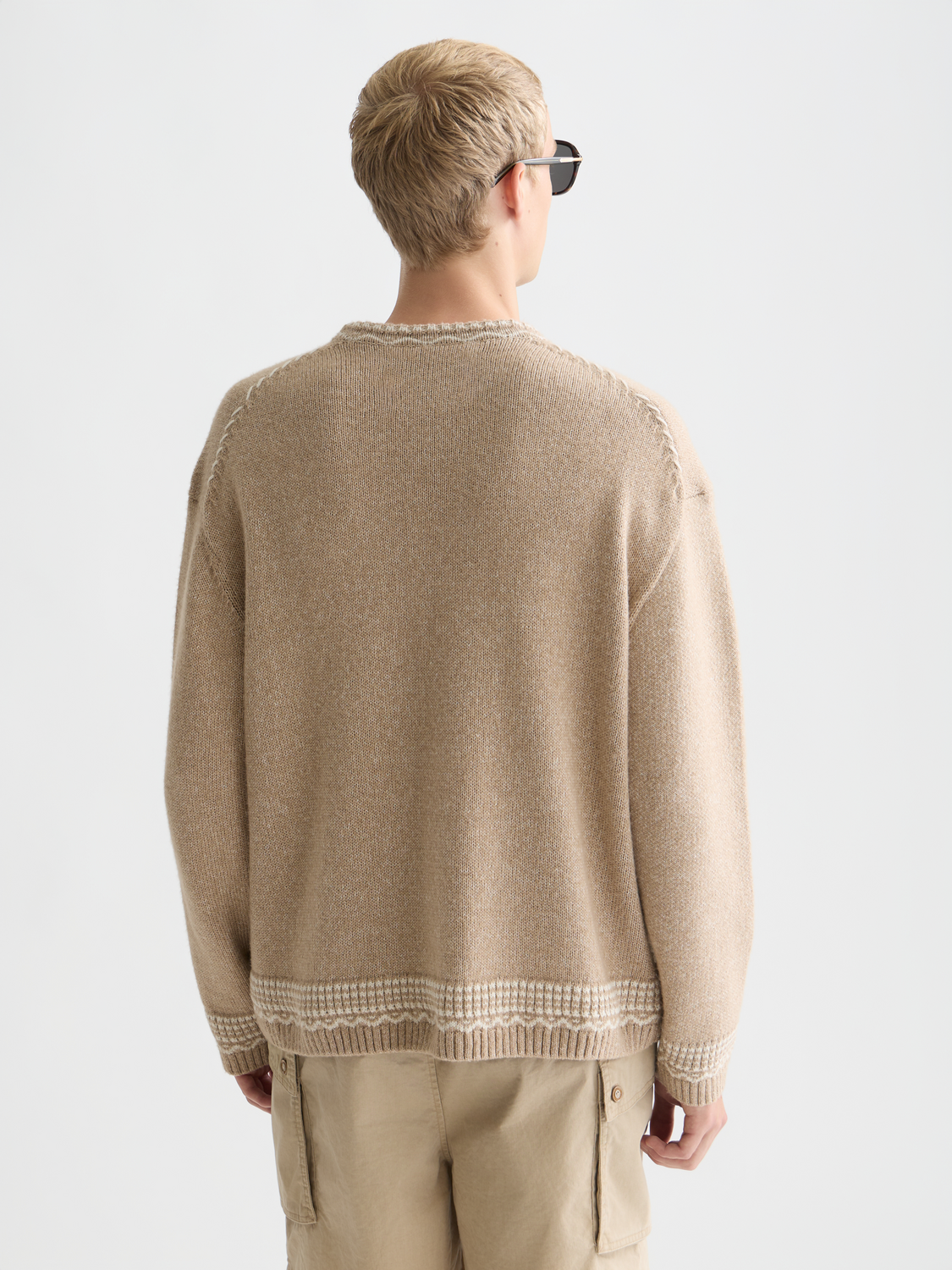 Scotch & Soda jacquard knit pullover featuring intricate patterns and a cozy fit, displayed on a neutral background.