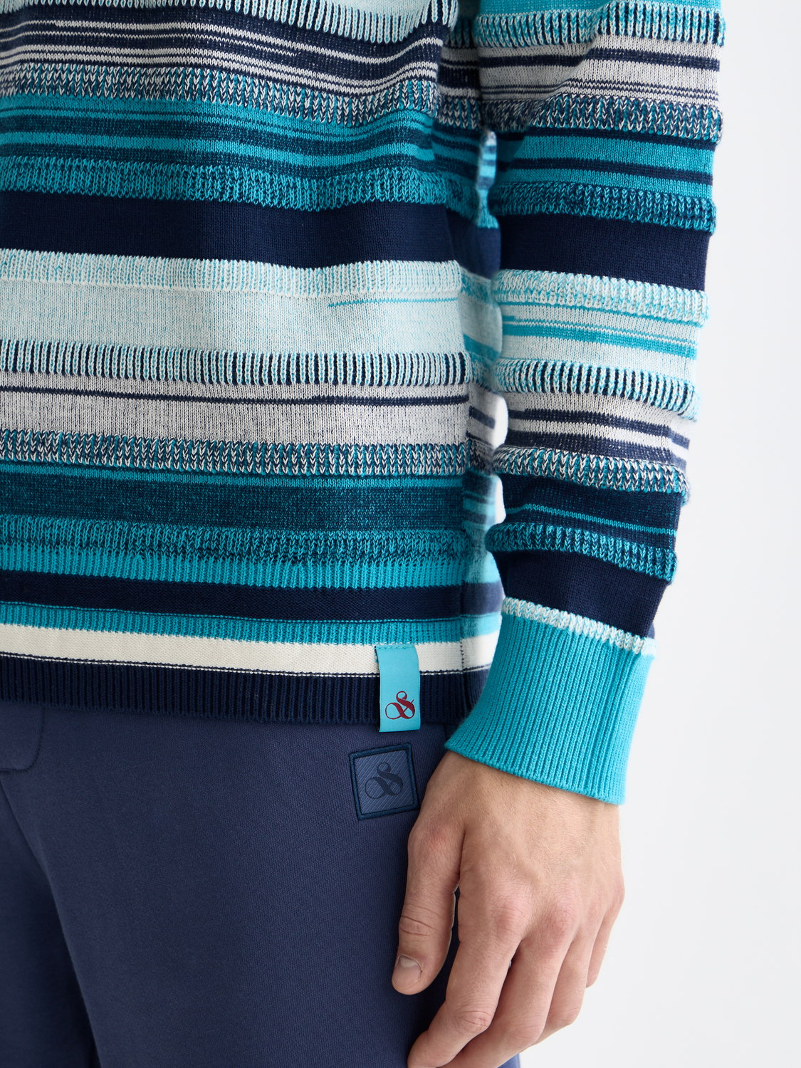Striped Scotch & Soda knitwear pullover with a cozy, casual design featuring multicolor horizontal stripes.