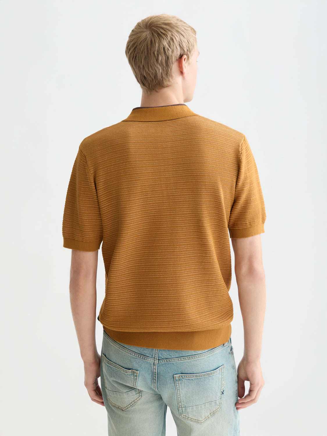 Knitted Scotch & Soda polo shirt in dark crimson, featuring a classic collar and button placket, back view.
