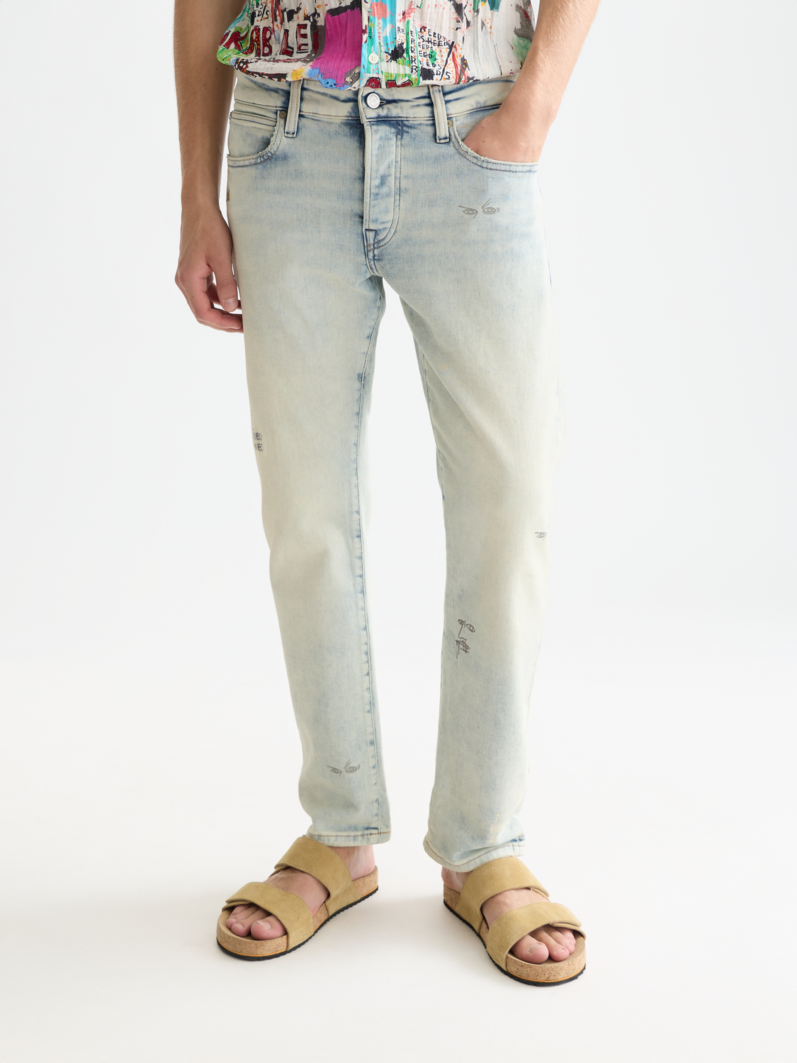 SCOTCH & SODA S&S x Basquiat Zee straight-fit denim jeans displayed on a model, showcasing the fit and stylish design.