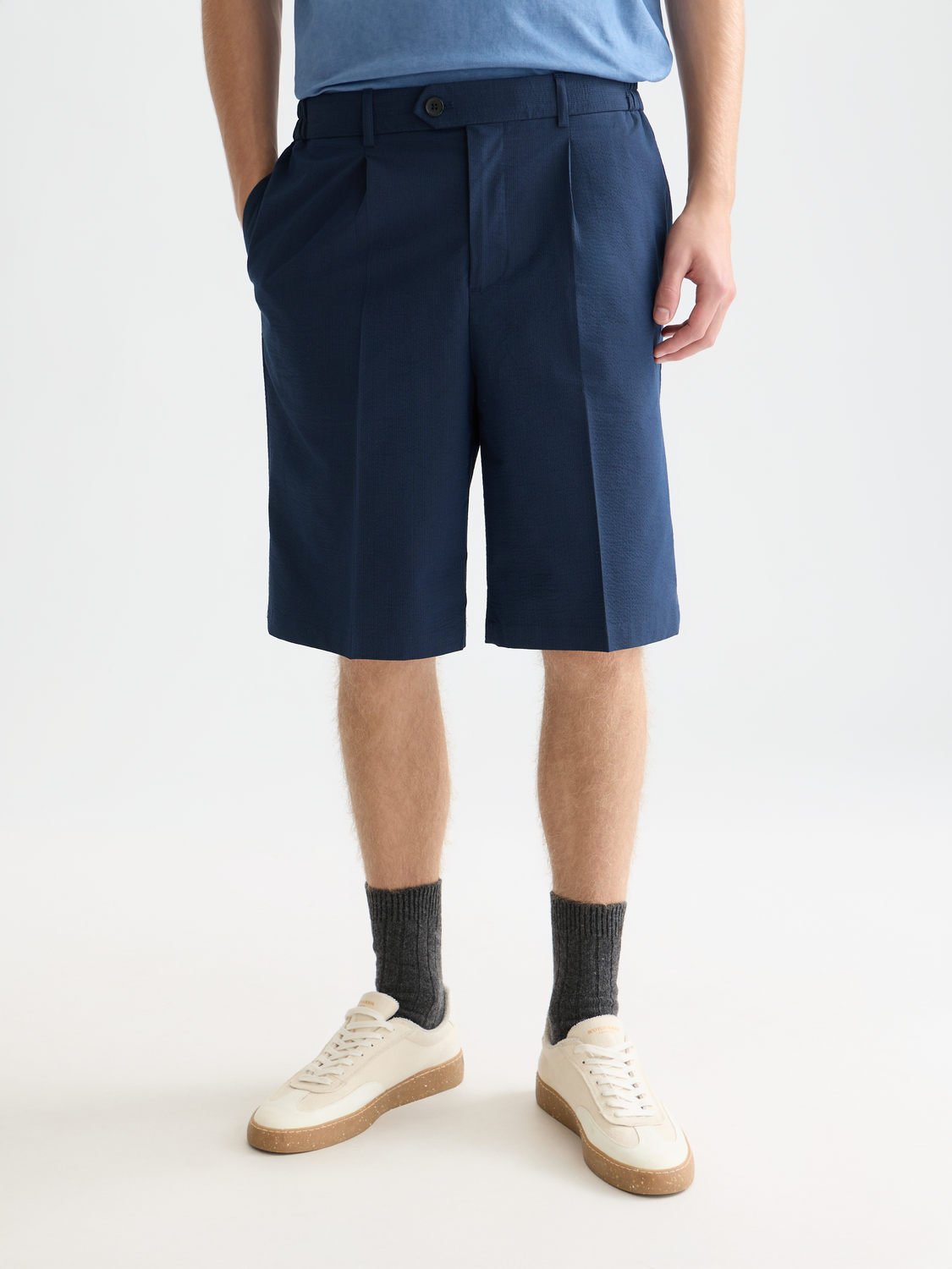 Seersucker shorts by Scotch & Soda, front view showing lightweight, striped fabric, casual fit, and adjustable waistband.