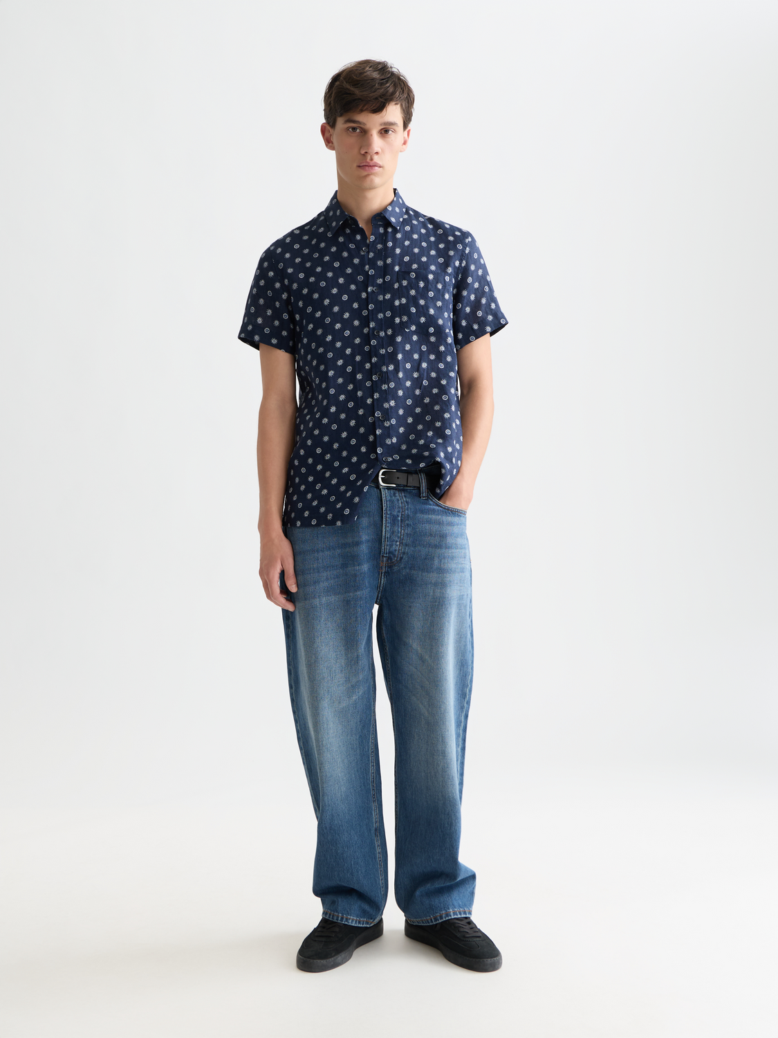 Printed short-sleeved linen shirt from Scotch & Soda, featuring a casual fit and vibrant pattern for warm-weather style.