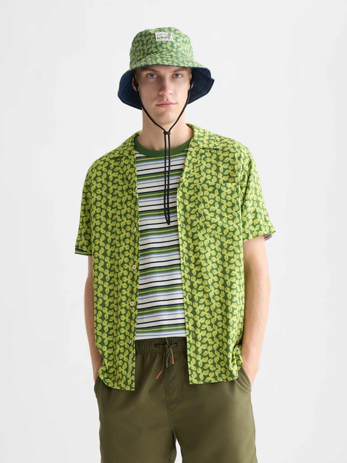 Printed short-sleeved shirt by Scotch & Soda featuring a vibrant, colorful design and classic fit, displayed on a hanger.