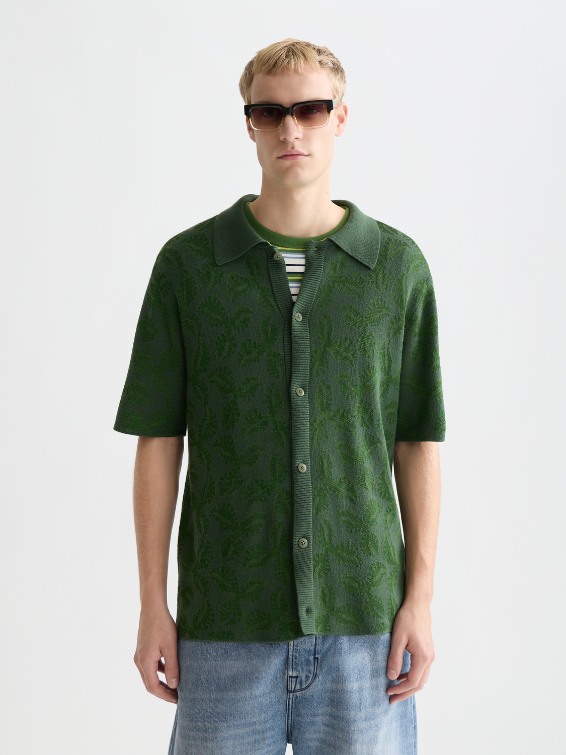 Knitted jacquard short-sleeved shirt by Scotch & Soda, featuring intricate knitwear pattern and short sleeves.