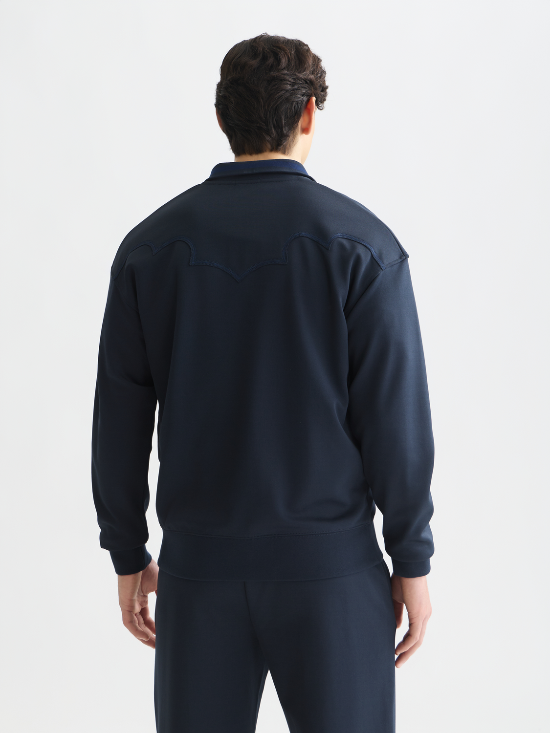 Scotch & Soda interlock zip-through sweatshirt in dark red, showing front view with zipper and ribbed cuffs.