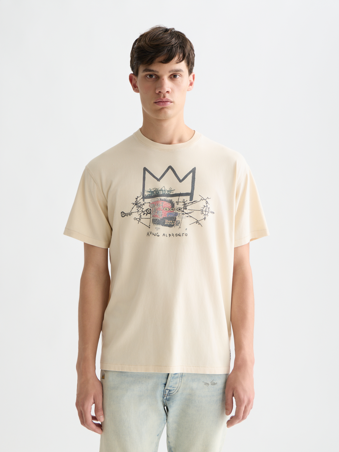 Short-sleeve Scotch & Soda T-shirt featuring Basquiat artwork print, crew neck, and vibrant graphic design.