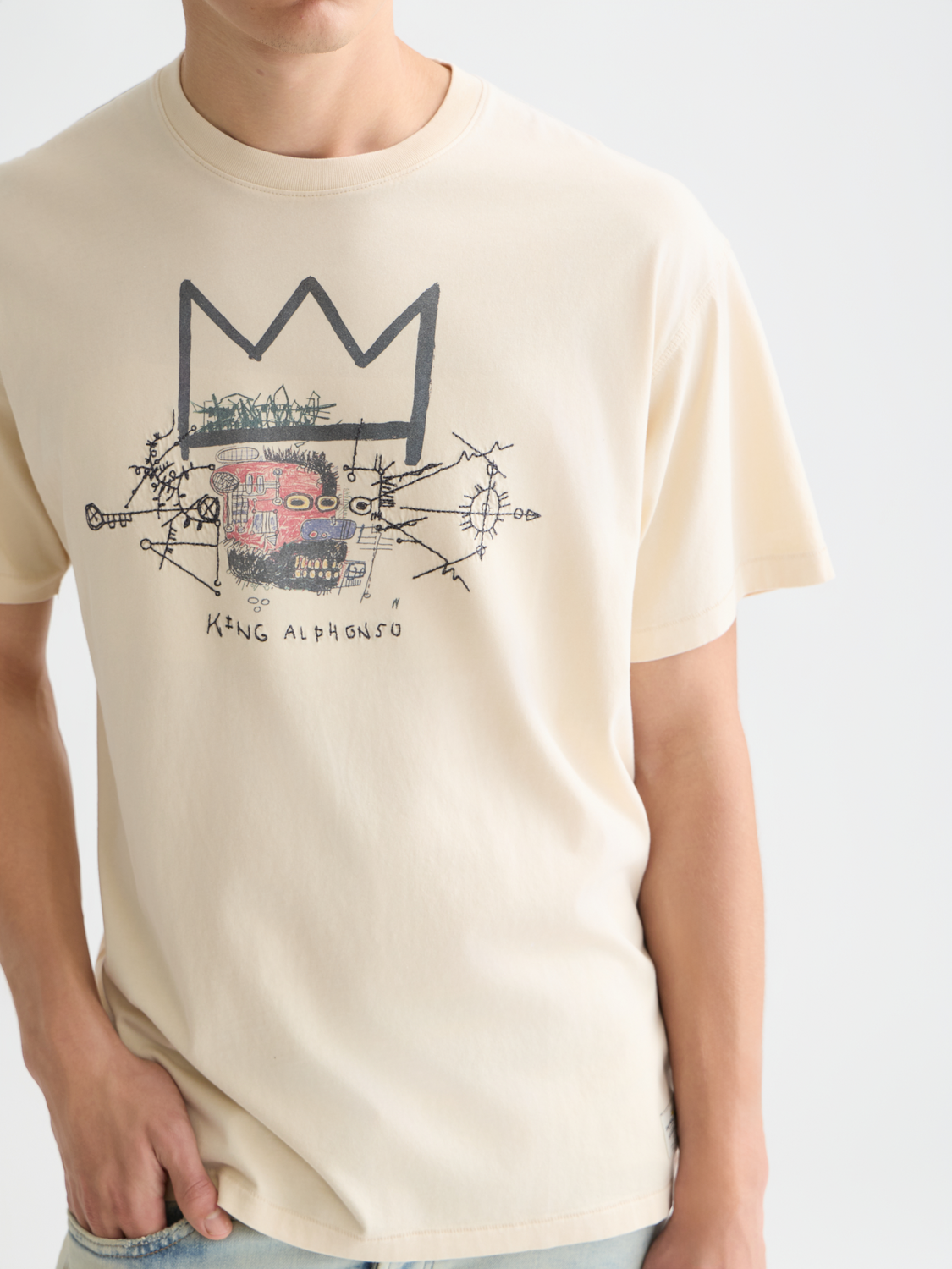 Short sleeve S&S x Basquiat artwork t-shirt by Scotch & Soda featuring colorful abstract Basquiat-inspired design on soft fabric.