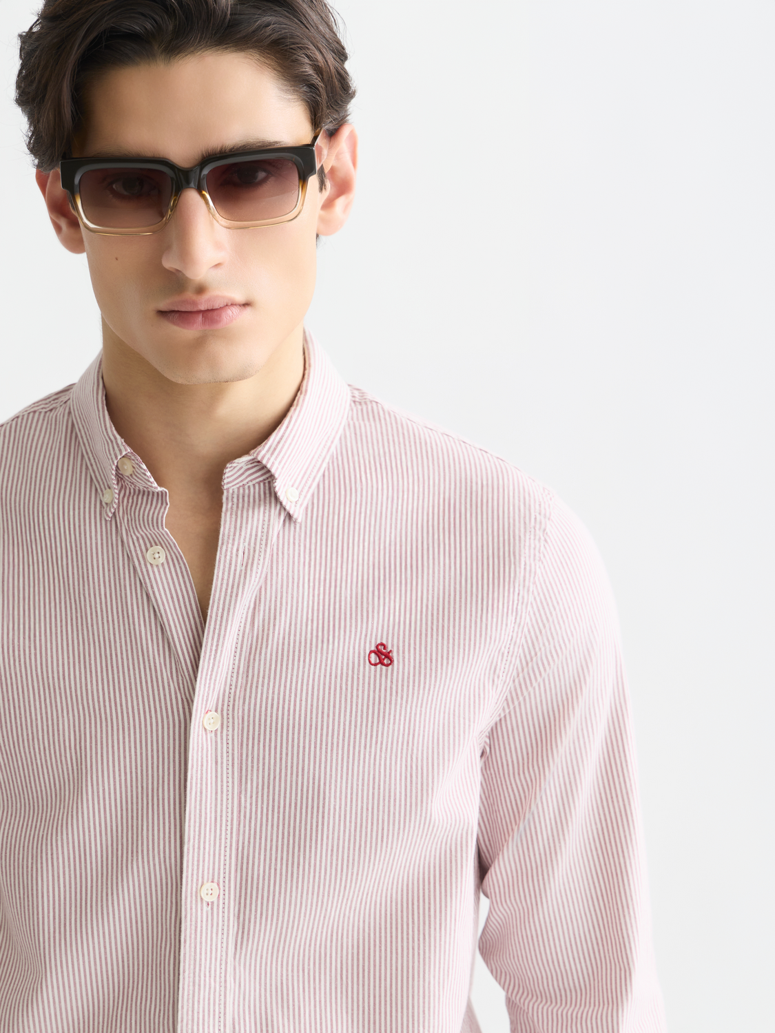 Long-sleeve striped Oxford shirt by Scotch & Soda, featuring classic blue and white vertical stripes and button-down collar.