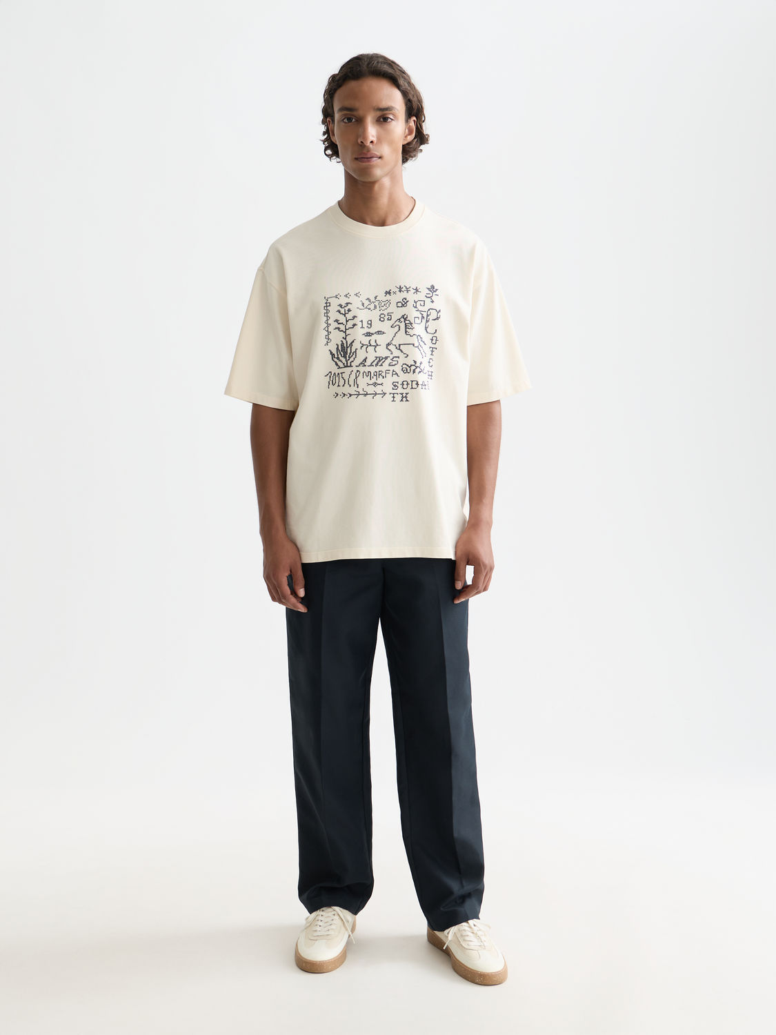 Short sleeve Scotch & Soda t-shirt featuring colorful cross-stitched artwork on the front, casual and stylish design.