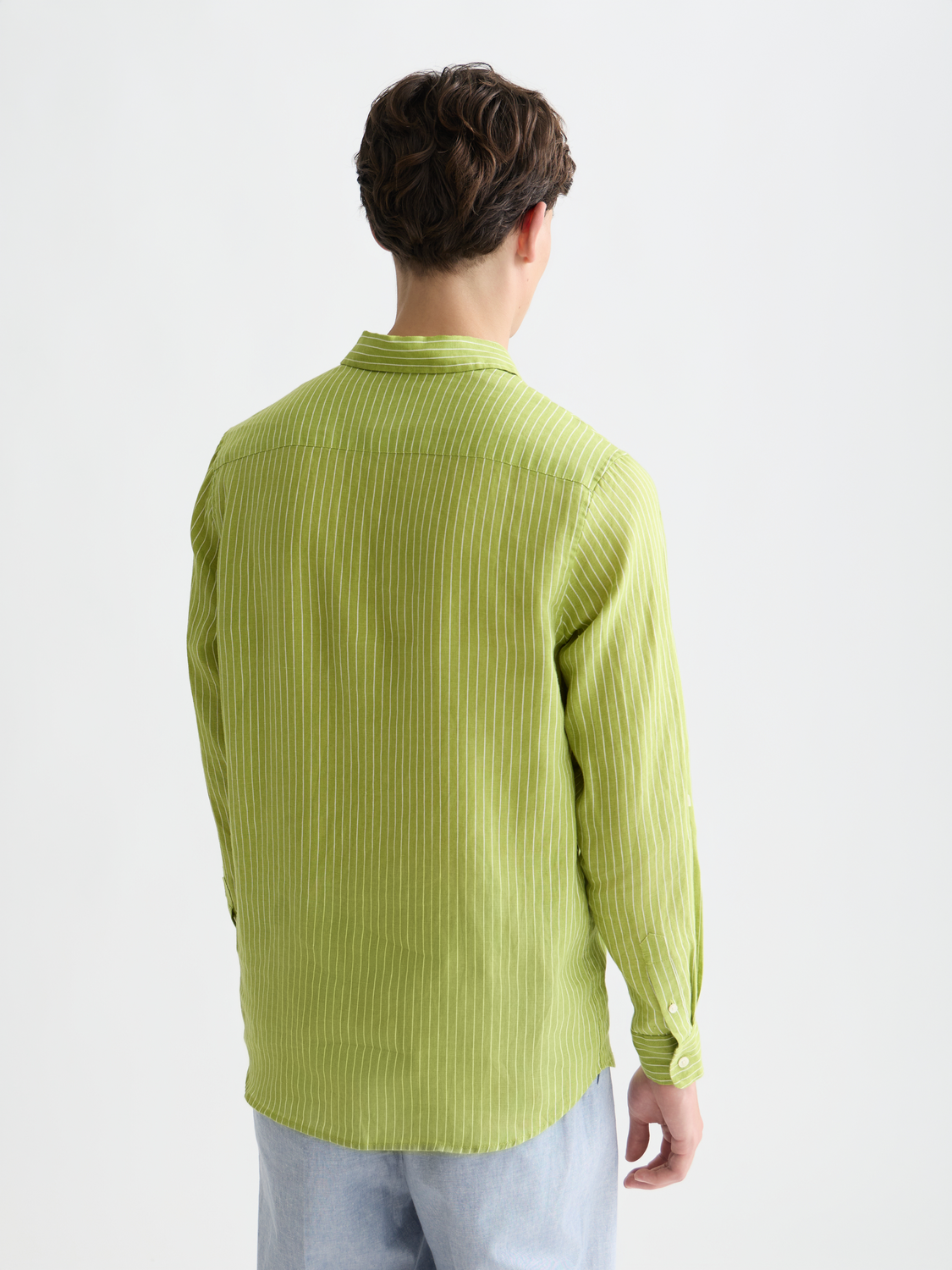 Striped linen long sleeve shirt by Scotch & Soda, shown from the back with a relaxed fit and classic pattern.