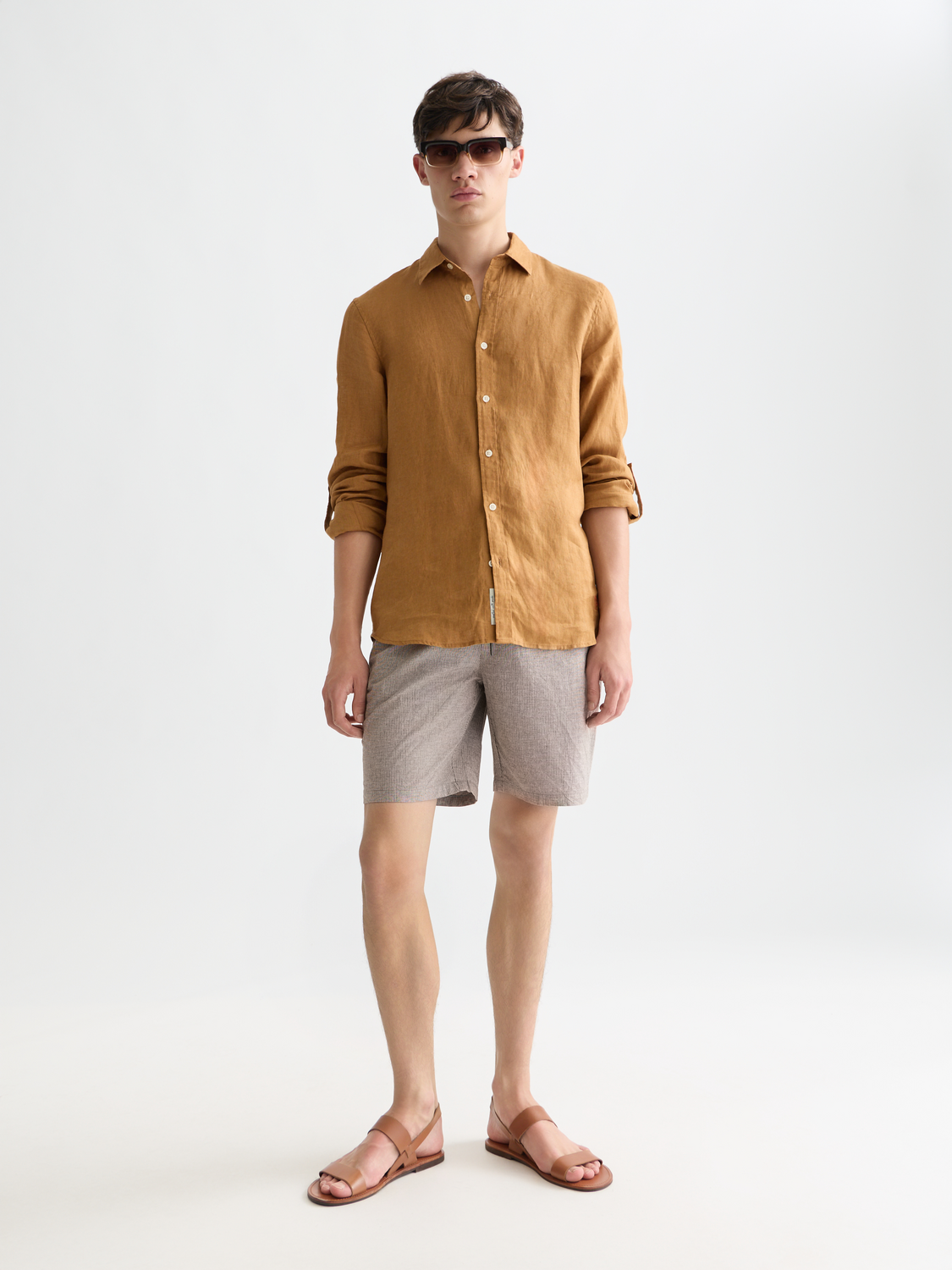 Fave cotton-linen shorts by Scotch & Soda, showing a relaxed fit in neutral tones, perfect for casual summer wear.