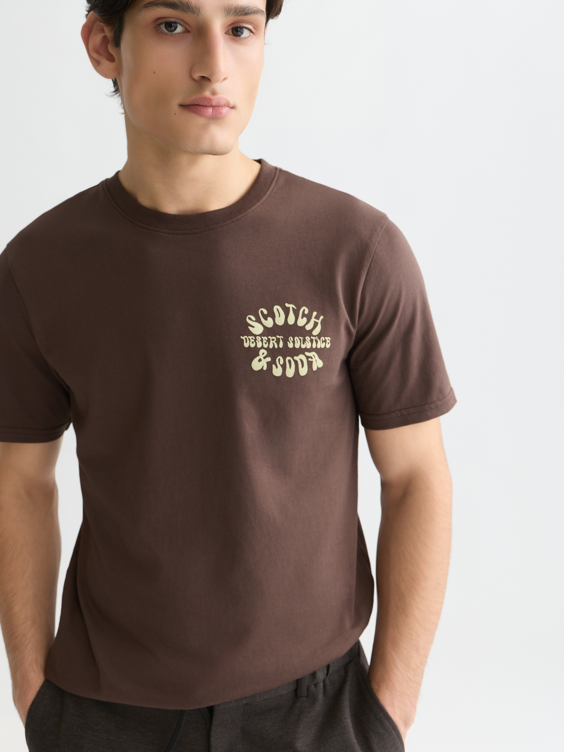 Colorful artwork t-shirt from Scotch & Soda, short sleeve design with vibrant graphic print on front.