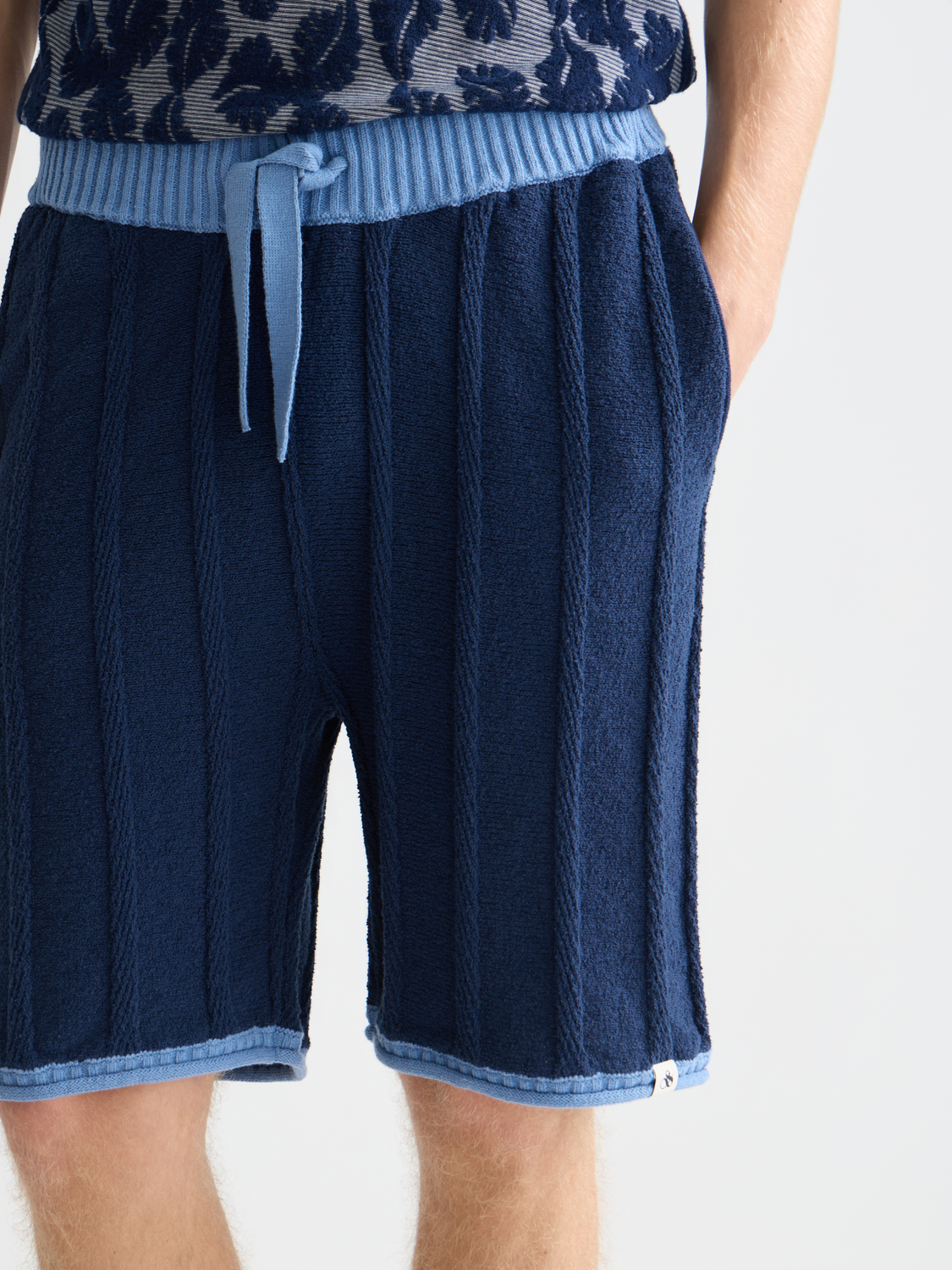 Knitted shorts by Scotch & Soda in neutral tones, featuring a relaxed fit and textured fabric for casual wear.