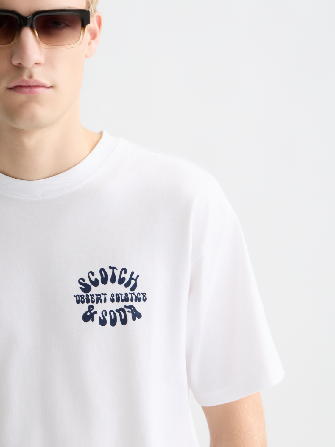 Light blue Scotch & Soda short sleeve artwork t-shirt with colorful graphic print on front, casual men's summer top.