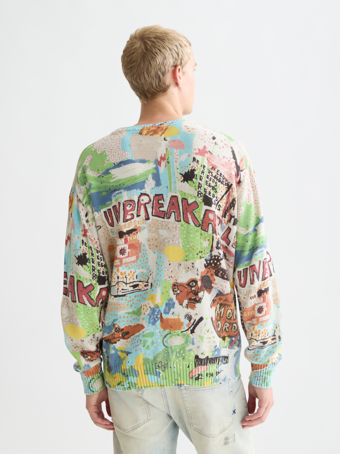Scotch & Soda S&S x Basquiat printed pullover knitwear with bold artwork design, front view showing colorful graphic pattern.