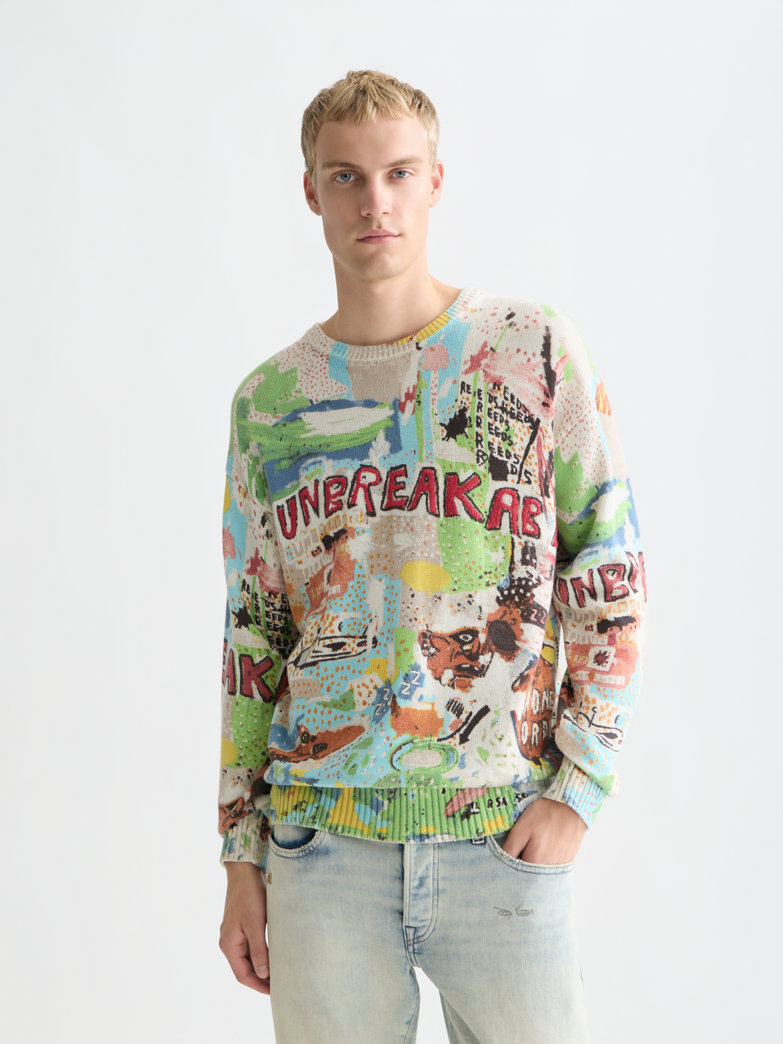 Scotch & Soda S&S x Basquiat printed knitwear pullover with colorful graphic design and crew neck, front view.