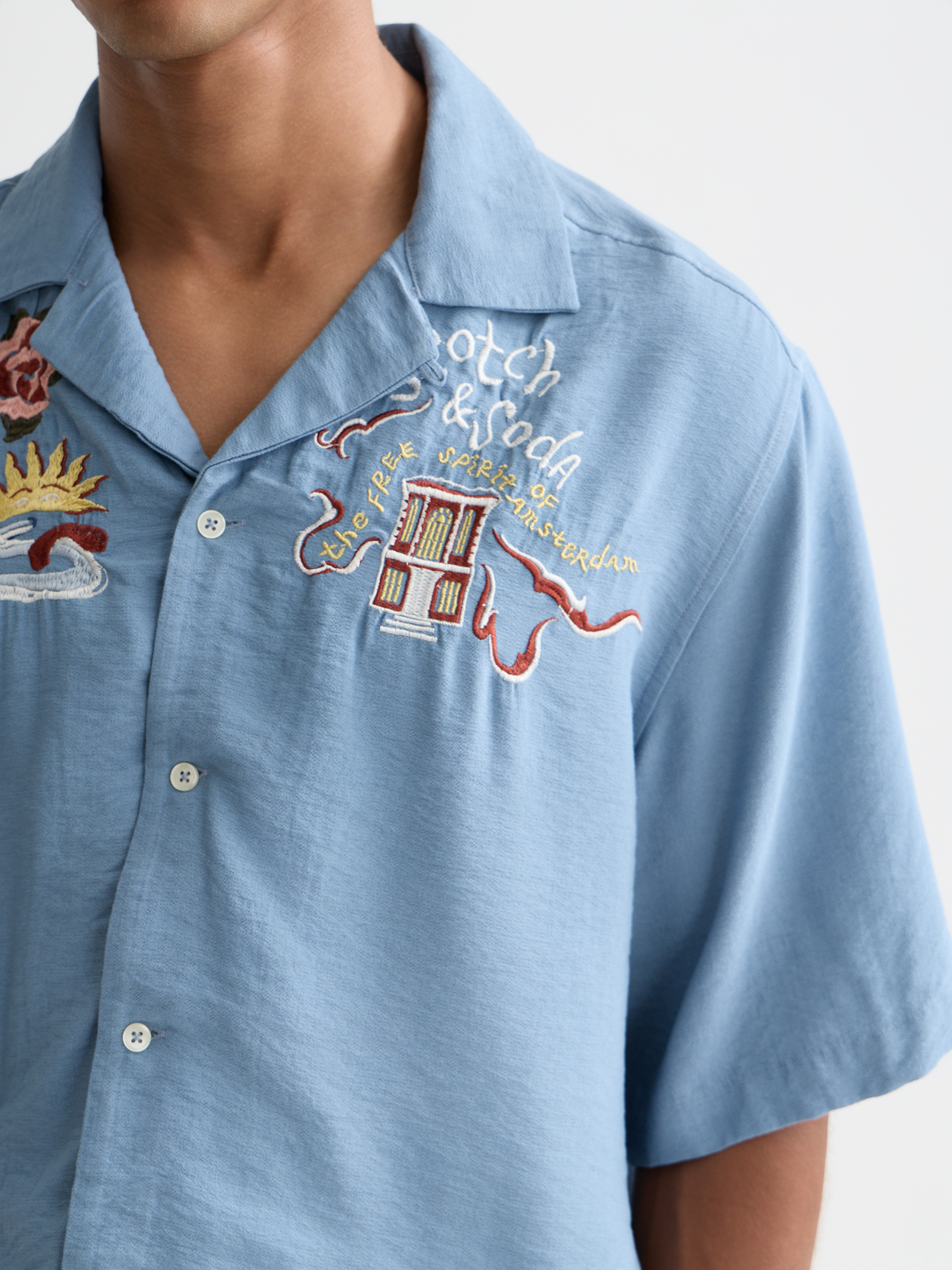 Embroidered short-sleeve shirt by Scotch & Soda with colorful floral embroidery on lightweight fabric.