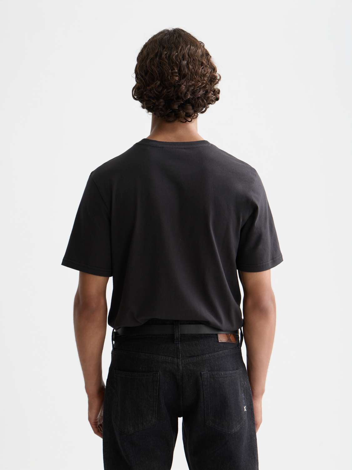 White short-sleeve Scotch & Soda logo t-shirt with front graphic, casual fit, and soft cotton fabric.