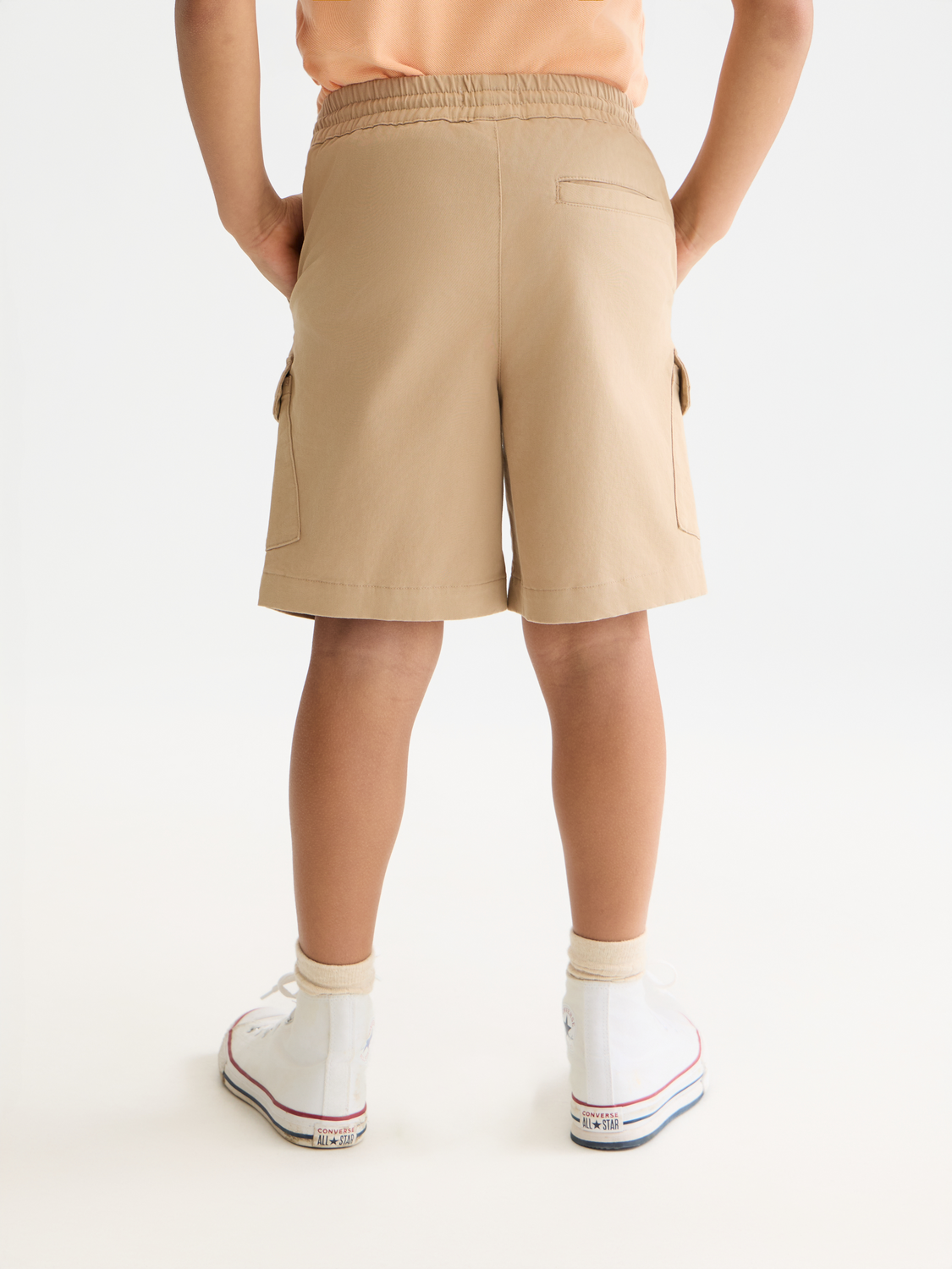 Kids cargo shorts by Scotch & Soda, showing back view with multiple pockets and casual fit for children.