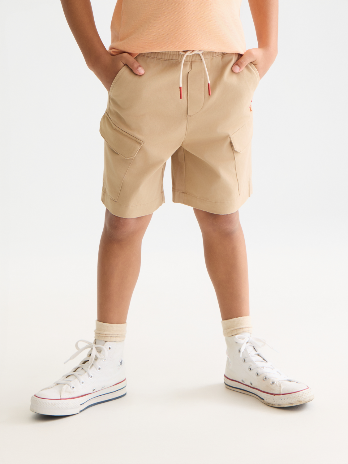 Kids' cargo shorts by Scotch & Soda with multiple pockets and a casual fit, shown in a front view.