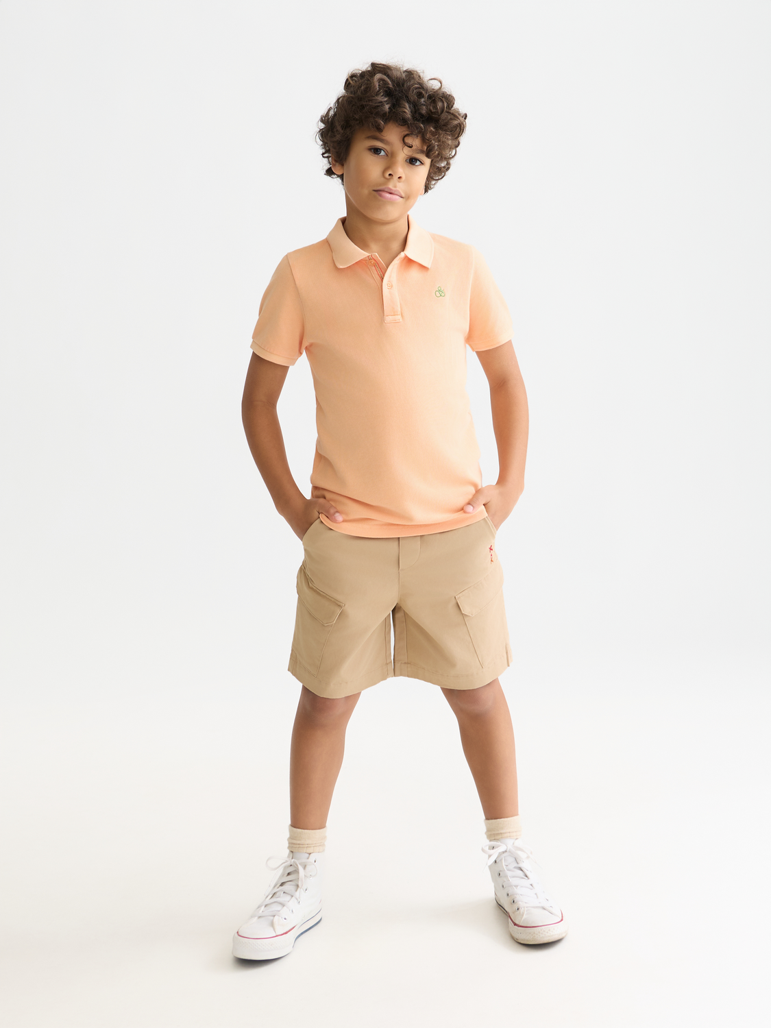 Kids' cargo shorts by Scotch & Soda, featuring multiple pockets and a casual fit, shown in a front view.