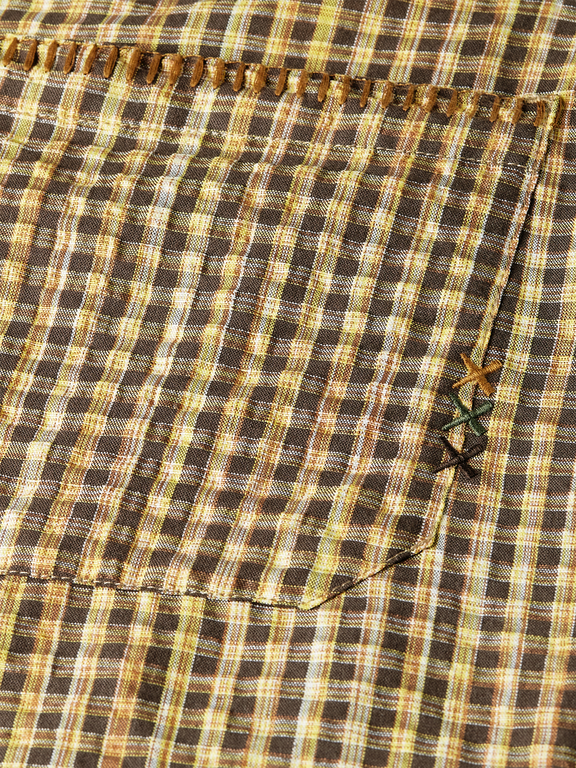 Scotch & Soda seersucker shorts in light blue and white striped fabric, casual summer style, front view with waistband and pockets.
