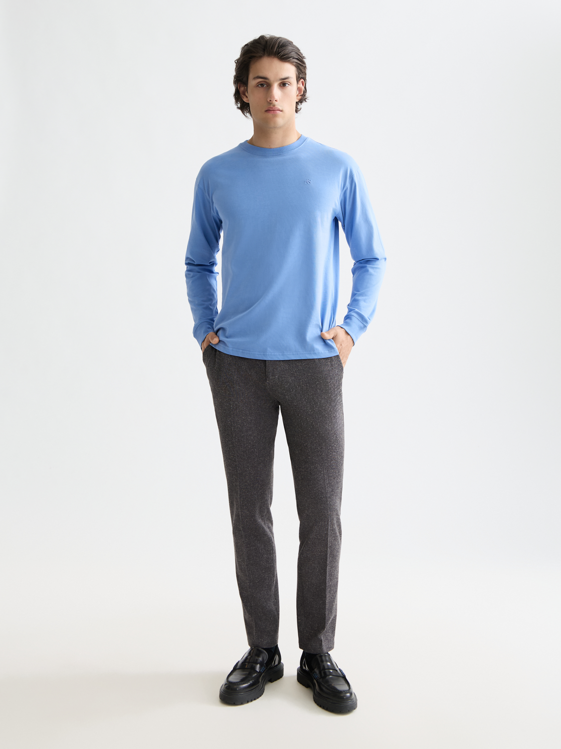 Slim-fit Stuart chinos pants by Scotch & Soda, featuring a classic design and tailored fit, shown in a neutral color.
