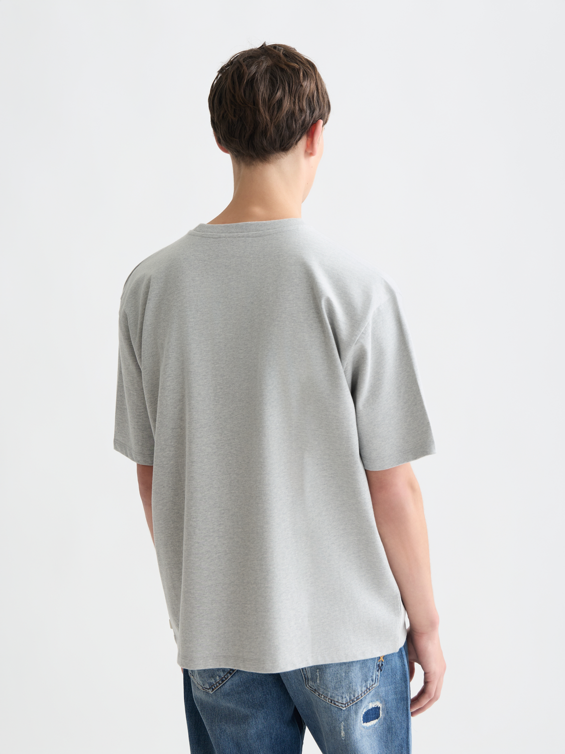 Light gray Scotch & Soda short-sleeve chest pocket T-shirt with a classic fit and minimal design, displayed flat.