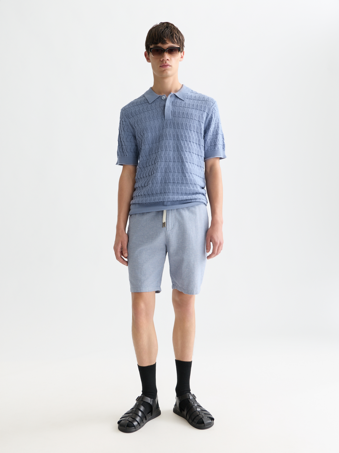 SCOTCH & SODA Fave cotton-linen shorts shown on a model, featuring a relaxed fit and neutral color for casual summer wear.