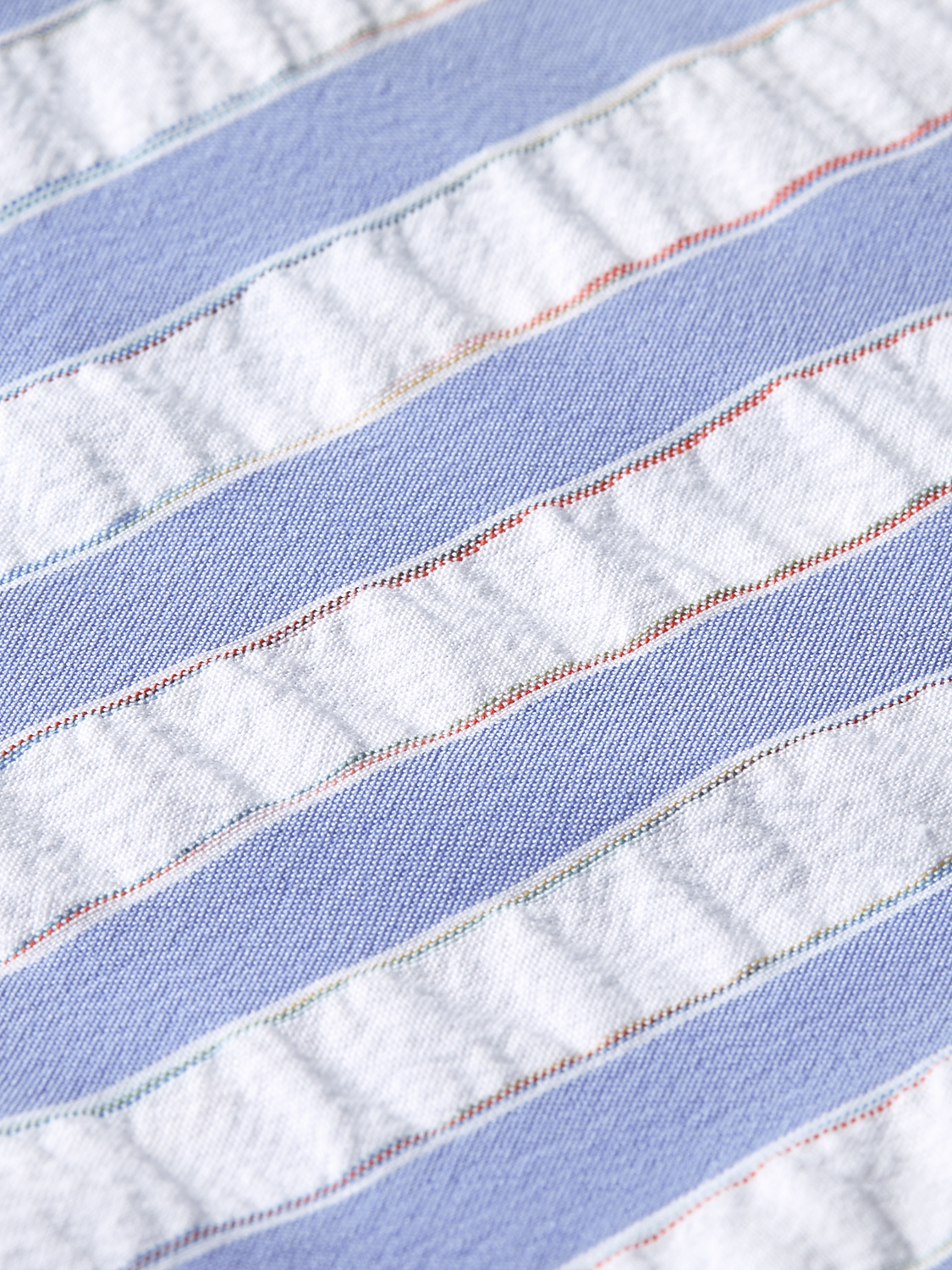 Kids striped swim shorts by Scotch & Soda, featuring colorful horizontal stripes and a comfortable elastic waistband.