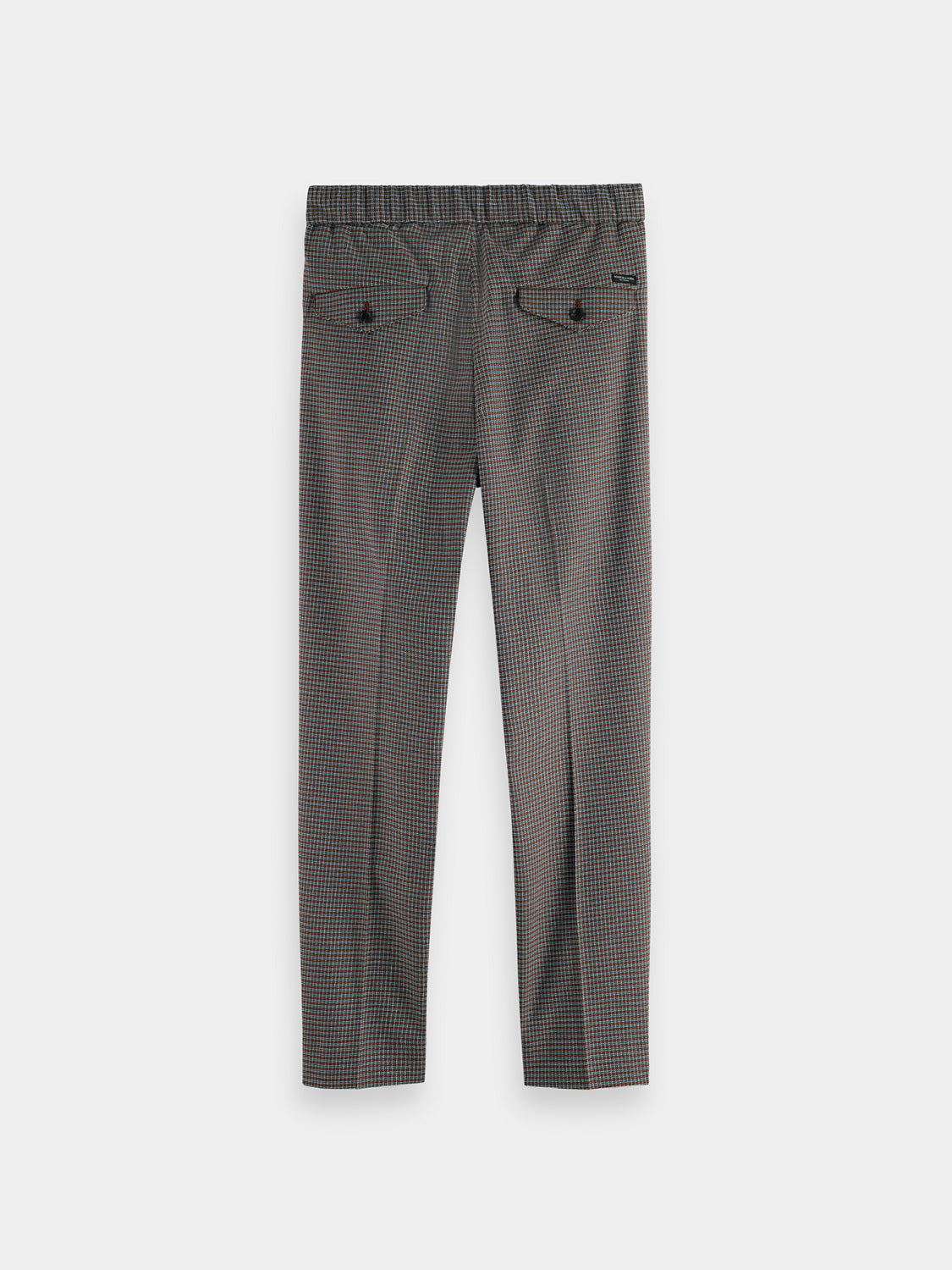 Dark navy Scotch & Soda Finch tapered fit pants hanging on a rack with a focus on the back view and waistband details.