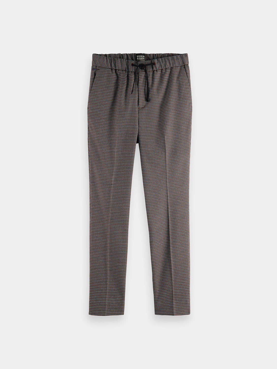 Scotch & Soda Finch tapered fit pants in neutral fabric, showing the tailored design and waistband detail.